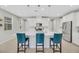 A modern kitchen featuring a large center island with seating, white cabinets, and stainless steel appliances at 787 Cottonwood Hill Pl, Henderson, NV 89011