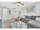 Open-concept living room with plush seating, neutral tones, and a decorative rug enhancing the space at 787 Cottonwood Hill Pl, Henderson, NV 89011
