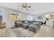 Spacious living area with a sectional sofa, dining table, and kitchen bar seating at 787 Cottonwood Hill Pl, Henderson, NV 89011