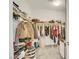 Spacious walk-in closet featuring ample shelving and organized clothing racks at 787 Cottonwood Hill Pl, Henderson, NV 89011