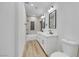 Bathroom featuring a double vanity, modern fixtures, and tile flooring at 8120 Pacific Cove Dr, Las Vegas, NV 89128