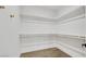 Spacious walk-in closet equipped with sturdy shelving, offering ample storage and organization at 8120 Pacific Cove Dr, Las Vegas, NV 89128