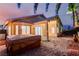 Backyard with an in-ground spa featuring a paver patio, palm trees, and string lights at 8433 Sea Glen Dr, Las Vegas, NV 89128
