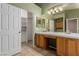 Bathroom featuring tiled floor, double sinks, vanity and walk in closet at 8433 Sea Glen Dr, Las Vegas, NV 89128