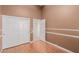 Bedroom features hardwood flooring, neutral paint and walk in closet at 8433 Sea Glen Dr, Las Vegas, NV 89128
