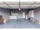 Spacious garage with custom cabinets, shelving, storage, and painted gray flooring at 8433 Sea Glen Dr, Las Vegas, NV 89128
