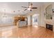 Open-concept living space featuring hardwood floors, a breakfast bar, and seamless flow into the kitchen at 8433 Sea Glen Dr, Las Vegas, NV 89128