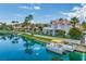 Beautiful waterfront property with a boat dock and lush green landscaping at 8433 Sea Glen Dr, Las Vegas, NV 89128