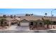 An aerial view of a single-story home with well-maintained landscaping and a spacious driveway at 870 Santa Maria Way, Mesquite, NV 89027