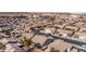Wide aerial view of community featuring numerous homes in a well-planned community with neighborhood shopping nearby at 870 Santa Maria Way, Mesquite, NV 89027