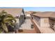 A backyard with a concrete patio, grill, and access to additional structures, all enclosed by a solid privacy wall at 870 Santa Maria Way, Mesquite, NV 89027