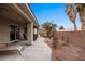 The backyard has a covered patio and desert landscaping, ideal for enjoying the outdoors at 870 Santa Maria Way, Mesquite, NV 89027