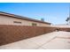 Spacious backyard with a high block wall, concrete patio, and a built-in grill for outdoor gatherings at 870 Santa Maria Way, Mesquite, NV 89027