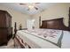 Spacious bedroom showcasing a decorative bed frame and coordinating dark-toned furniture at 870 Santa Maria Way, Mesquite, NV 89027