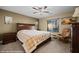 Cozy bedroom with a ceiling fan and a comfortable seating area at 870 Santa Maria Way, Mesquite, NV 89027
