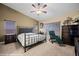 Spacious bedroom with carpet flooring, a ceiling fan, and lots of natural light from the windows at 870 Santa Maria Way, Mesquite, NV 89027