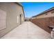 Long driveway leading to a backyard gate, side of house with desert landscaping at 870 Santa Maria Way, Mesquite, NV 89027