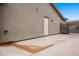 View of a clean side of house featuring an entry door and gated parking in backyard at 870 Santa Maria Way, Mesquite, NV 89027