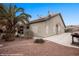 Exterior view showcases desert landscaping with a spacious backyard and privacy wall at 870 Santa Maria Way, Mesquite, NV 89027