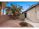 Exterior view of the side yard with desert landscaping, creating a low-maintenance space at 870 Santa Maria Way, Mesquite, NV 89027