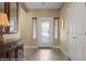Bright foyer features a decorative glass front door and neutral tile flooring at 870 Santa Maria Way, Mesquite, NV 89027