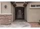 Beautiful front entrance featuring a decorative security gate, stone accents and modern design at 870 Santa Maria Way, Mesquite, NV 89027