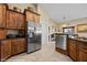 Modern kitchen featuring stainless steel appliances, custom cabinetry, and granite countertops at 870 Santa Maria Way, Mesquite, NV 89027