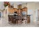 Kitchen island with barstool seating and granite countertops, next to cabinets at 870 Santa Maria Way, Mesquite, NV 89027