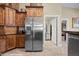 View of the kitchen featuring stainless steel appliances, wood cabinetry, and granite countertops at 870 Santa Maria Way, Mesquite, NV 89027