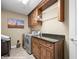 Well-equipped laundry room featuring modern appliances and built-in cabinetry at 870 Santa Maria Way, Mesquite, NV 89027