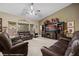 Inviting living room with comfortable seating, a large TV, and bright windows at 870 Santa Maria Way, Mesquite, NV 89027