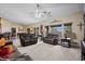 Bright, open living room featuring vaulted ceilings, neutral carpet, and comfortable seating arrangements at 870 Santa Maria Way, Mesquite, NV 89027