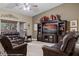 Cozy living room showcasing a large entertainment center, plush seating, and a relaxed atmosphere at 870 Santa Maria Way, Mesquite, NV 89027