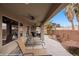 A covered patio with lounge chairs provides ample space for outdoor living and entertaining at 870 Santa Maria Way, Mesquite, NV 89027