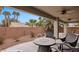 Spacious patio with comfortable seating and a fire pit with views of the backyard at 870 Santa Maria Way, Mesquite, NV 89027