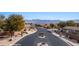 Inviting community entrance featuring well-maintained landscaping, desert rocks, and a clear view of the surrounding neighborhood at 870 Santa Maria Way, Mesquite, NV 89027