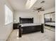 Bedroom with a skylight, ceiling fan, and mirrored closet doors at 401 Estella Ave, Las Vegas, NV 89107