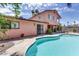 Serene backyard pool featuring a well-maintained patio and lush surroundings, creating a private and tranquil oasis at 401 Estella Ave, Las Vegas, NV 89107