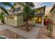 Two-story house featuring a manicured lawn, two-car garage, and covered porch entryway at 10899 Royal Highlands St, Las Vegas, NV 89141