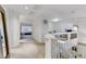 Upstairs hallway with plush carpet, white walls, and ample natural light at 10899 Royal Highlands St, Las Vegas, NV 89141