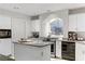 Kitchen featuring granite countertops, an island, and stainless steel appliances at 10899 Royal Highlands St, Las Vegas, NV 89141