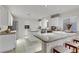 Bright kitchen with white cabinetry, granite countertops, and stainless steel appliances at 10899 Royal Highlands St, Las Vegas, NV 89141