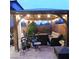 Inviting backyard gazebo featuring string lights and comfortable outdoor seating at 10976 Bluebell Basin Rd, Las Vegas, NV 89179