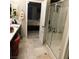 Modern bathroom featuring glass enclosed shower and tile floors, connecting to a bedroom space at 10976 Bluebell Basin Rd, Las Vegas, NV 89179