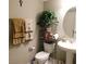 Bathroom with a round mirror, towels, and decorative shelf at 10976 Bluebell Basin Rd, Las Vegas, NV 89179