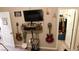 This room has musical instruments and a television mounted on the wall at 10976 Bluebell Basin Rd, Las Vegas, NV 89179