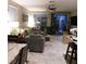 Bright living room featuring tiled floors, lots of light, and comfortable seating at 10976 Bluebell Basin Rd, Las Vegas, NV 89179