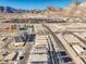 A high angle aerial shot of a new housing development, nestled at the foot of majestic mountains at 11576 Ashy Storm Ave, Las Vegas, NV 89138