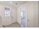 Bright and airy foyer featuring tiled floors, a window, and convenient access to other rooms at 11576 Ashy Storm Ave, Las Vegas, NV 89138