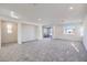 Spacious living room area featuring neutral color palette and recessed lighting at 11576 Ashy Storm Ave, Las Vegas, NV 89138